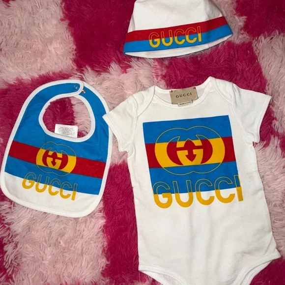 Gucci Kids' White Bib, Onesie And Beanie Set with Blue, Red, and Yellow Accents - Picture 3 of 7